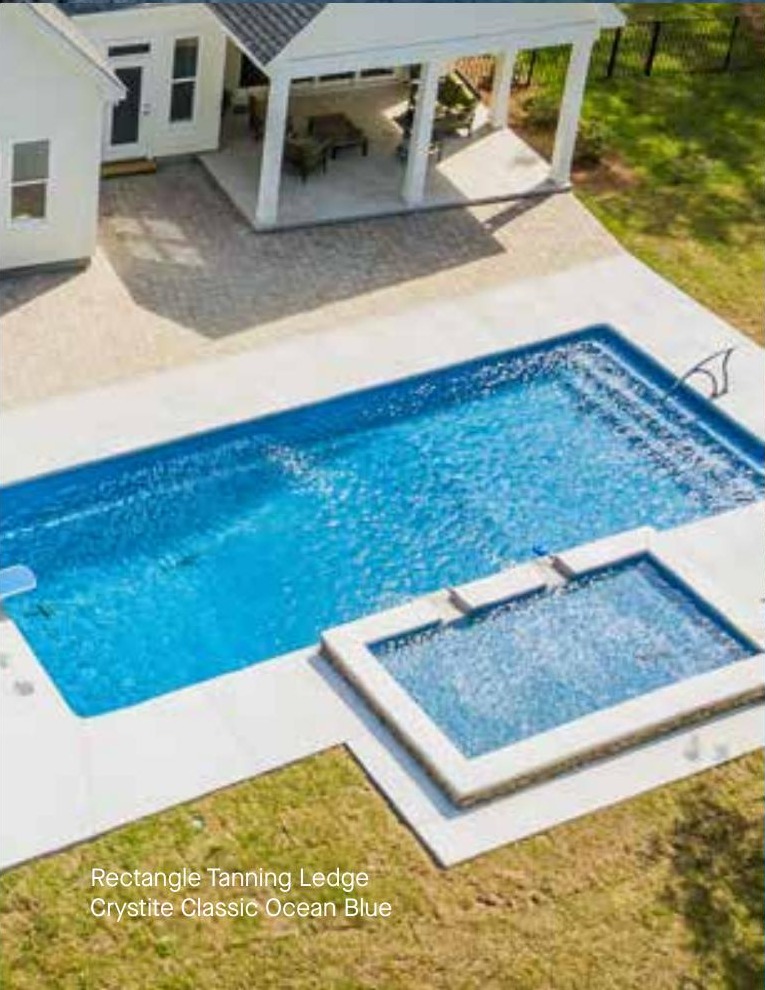 Rectangle Tanning Ledge fiberglass pool in a real backyard