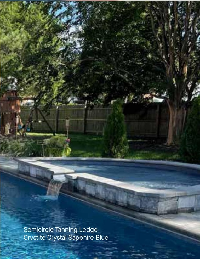 Semicircle Tanning Ledge fiberglass pool in a real backyard
